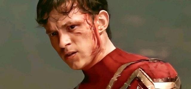 Close-up of a torn, battle-damaged Spider-Man suit, reflecting the street-level toll of Brand New Day's confirmed plot